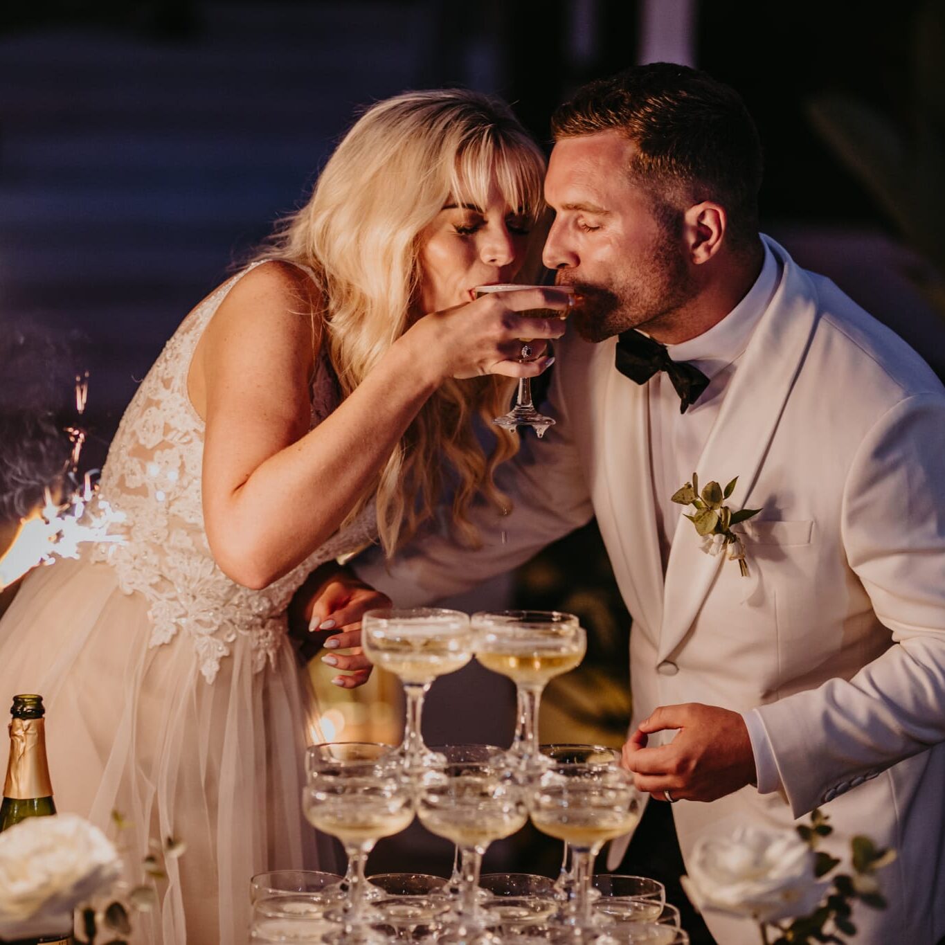 couple enjoying a champagne tower at a ibiza wedding bar service 